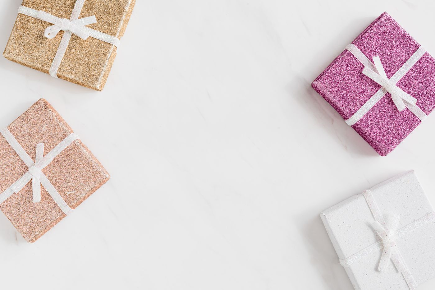 3d printed keychain custom name — Glittery gift boxes on a white background with ample copy space, perfect for celebrations