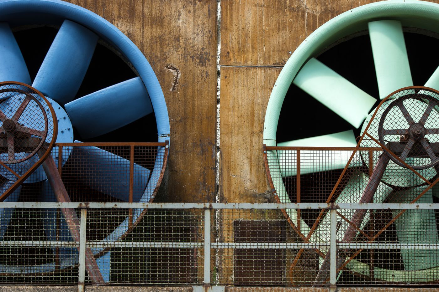 resin 3d printing safety — Close-up of large industrial ventilators mounted on an aging building exterior