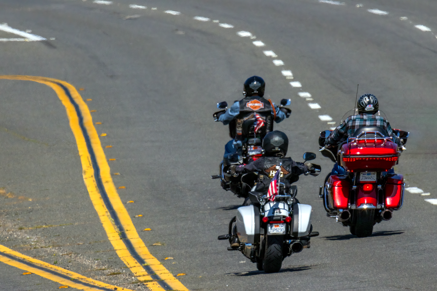 3d printed accessories for bike — Three motorcyclists riding freely on a highway, enjoying the thrill of the open road