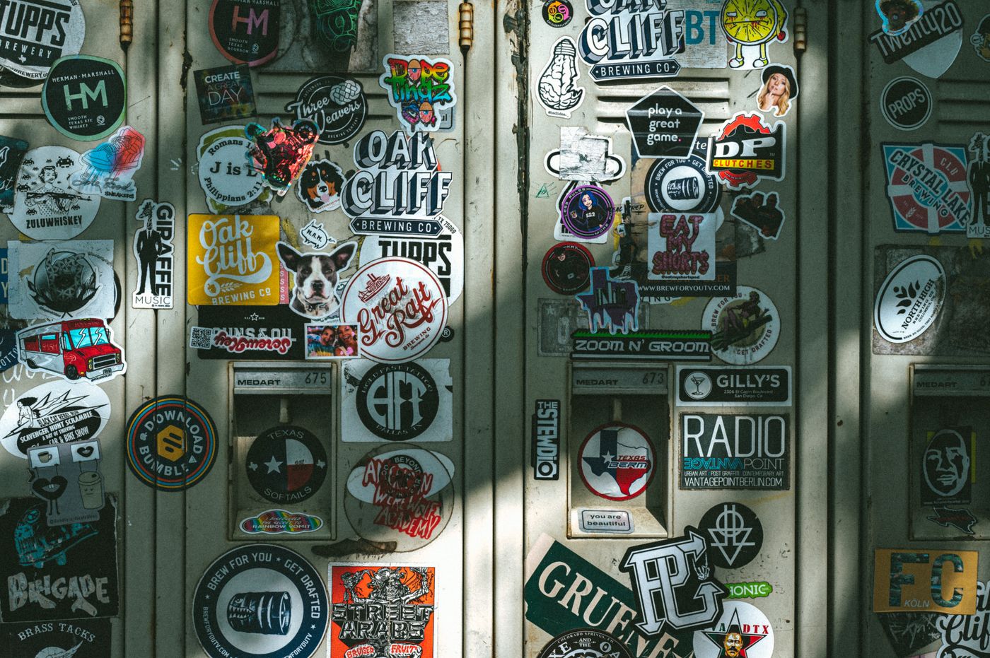 cartoon stickers for study table — Vibrant assortment of stickers covering lockers in Dallas, Texas