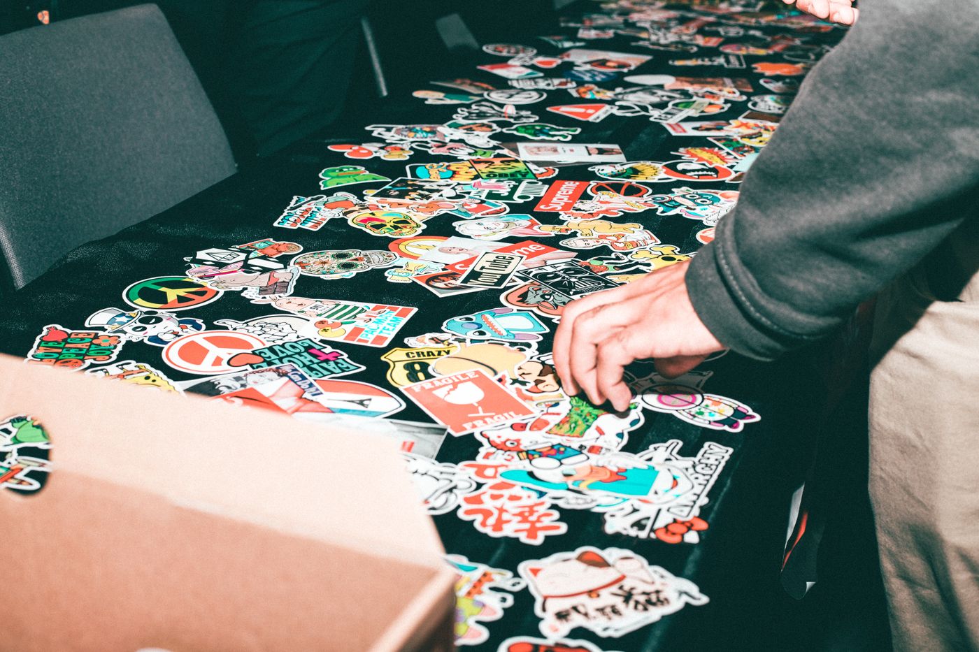 custom sticker sheets — Vibrant assortment of stickers displayed on a table indoors