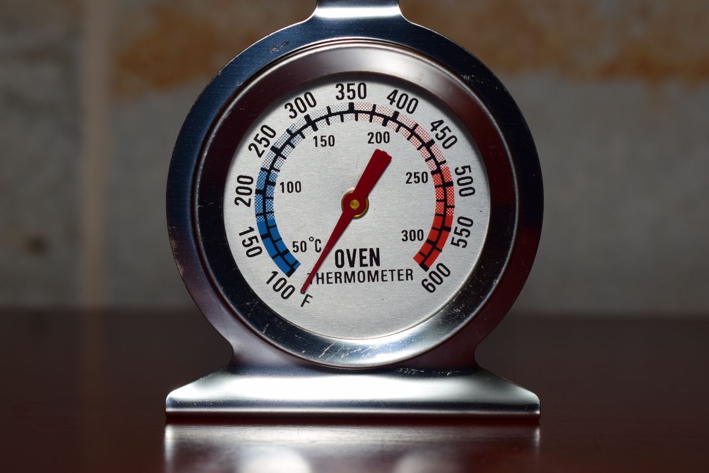 petg print settings — Close-up of a metallic oven thermometer showing temperature in Celsius and Fahrenheit