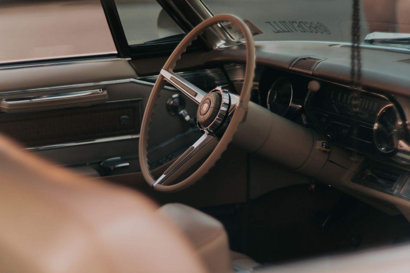 scooter keychain — Close-up of a classic car's steering wheel in Abu Dhabi, UAE
