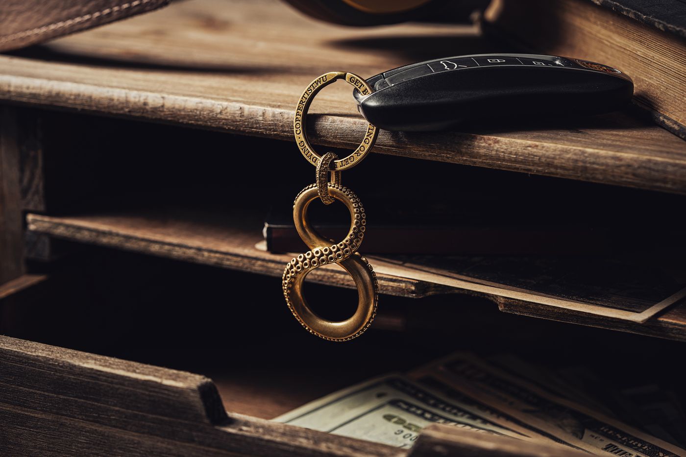 maruti swift keychain — Elegant infinity symbol keychain with car key on rustic wooden desk, conveying sophistication and luxury