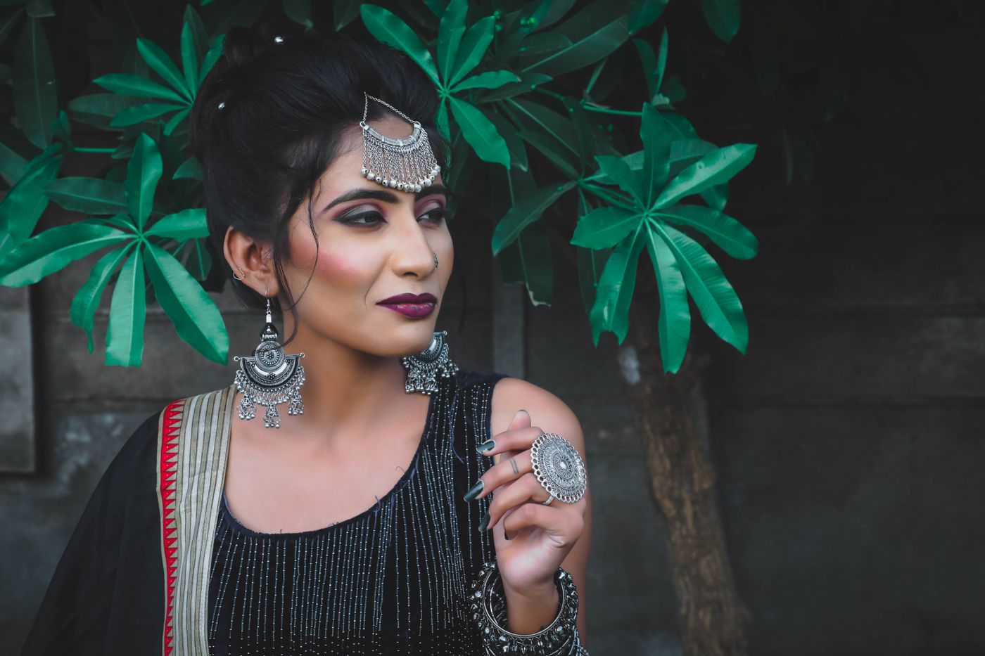 3d printed jewellery — Portrait of an elegant Indian woman wearing traditional jewelry and attire outdoors
