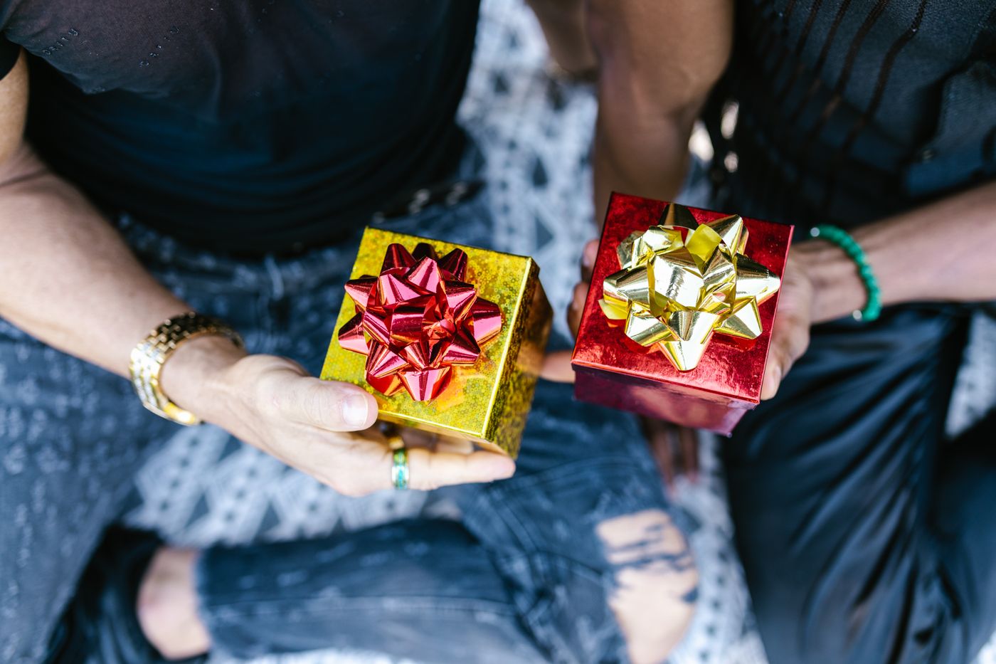 alphabet keychain — Two people holding beautifully wrapped gift boxes with bows, perfect for celebrations