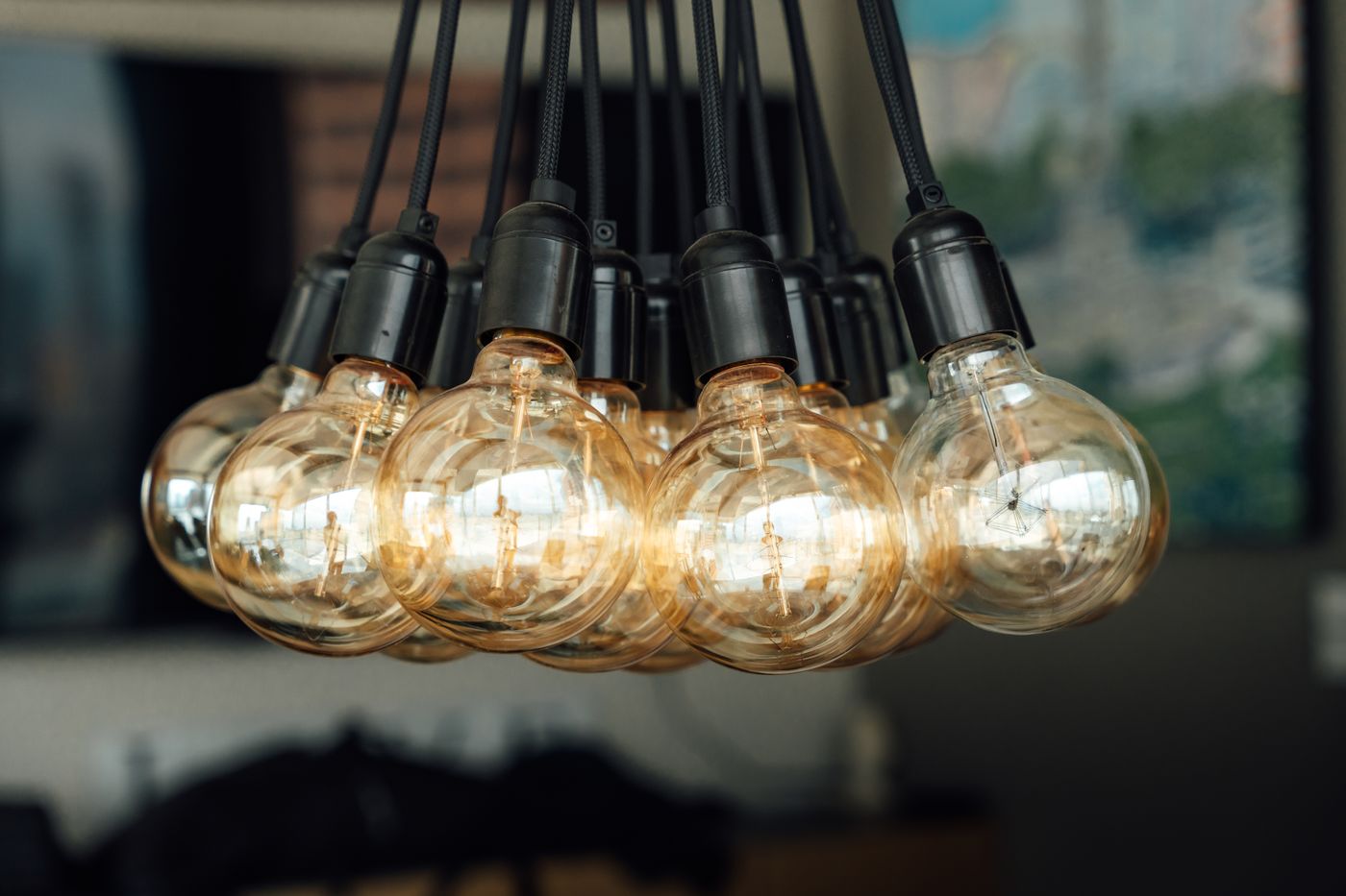 filament drying — Warm glowing vintage light bulbs hanging indoors, creating an industrial and cozy ambiance